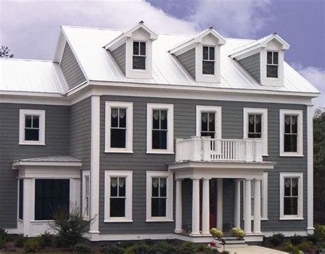 white house gray metal roof|houses with white metal roofs.